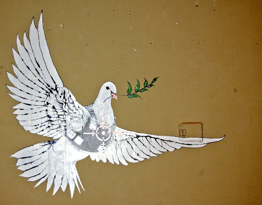 https://creativecommons.org/licenses/by-sa/4.0/; https://upload.wikimedia.org/wikipedia/commons/1/11/Banksy_-_Peace_Dove_-_2008-03_-_close-up.jpg