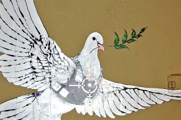 https://creativecommons.org/licenses/by-sa/4.0/; https://upload.wikimedia.org/wikipedia/commons/1/11/Banksy_-_Peace_Dove_-_2008-03_-_close-up.jpg